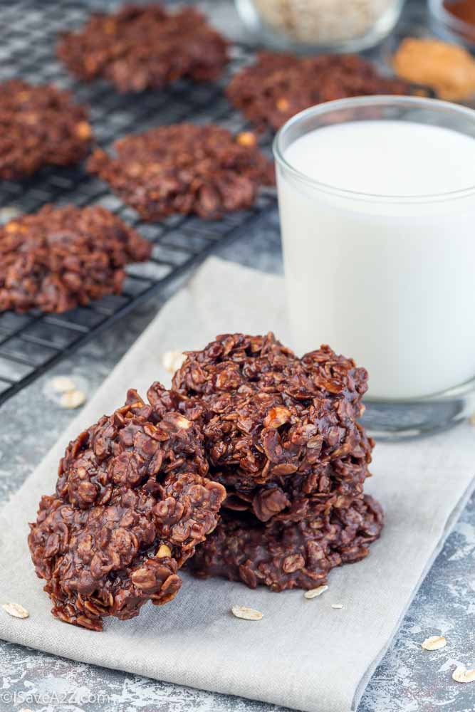 Flourless no bake peanut butter and oatmeal chocolate cookies, with glass of milk, vertical
