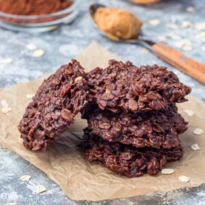 Flourless no bake peanut butter and oatmeal chocolate cookies on a parchment, square format