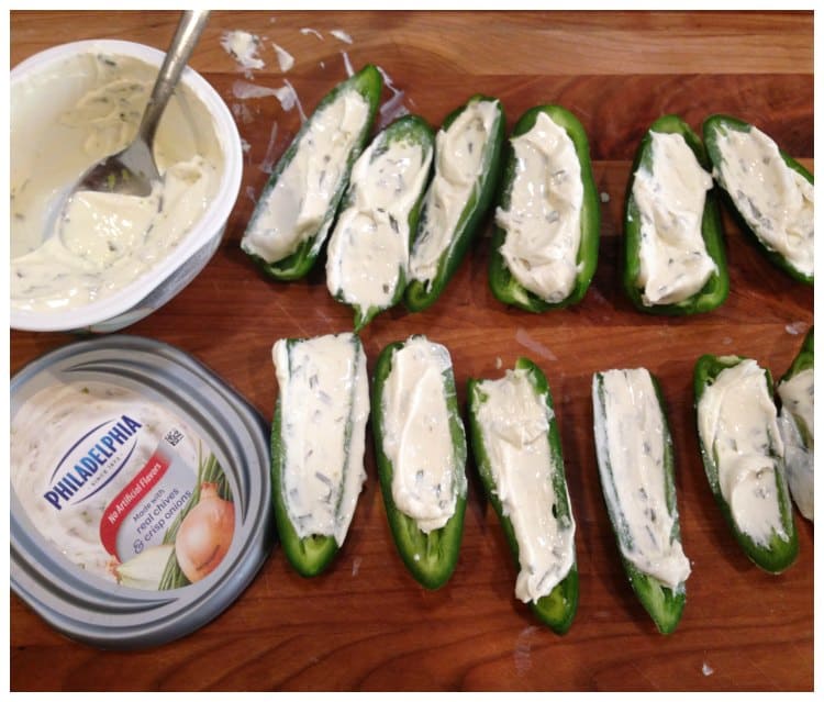 Add Philadelphia Cream Cheese to the center of each jalapeno #SpreadTheFlavor