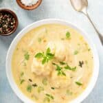 Chicken dumplings soup with cream and thyme