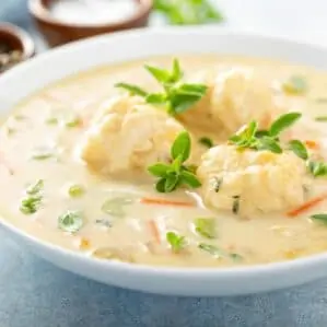 Chicken dumplings soup with cream and thyme