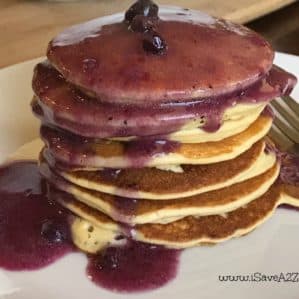 Low Carb Keto Friendly Pancakes topped with a blueberry butter sauce