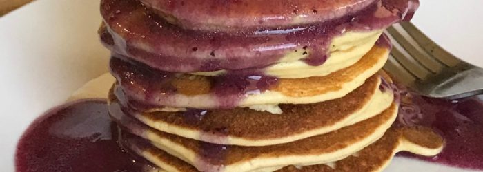 Low Carb Keto Friendly Pancakes topped with a blueberry butter sauce