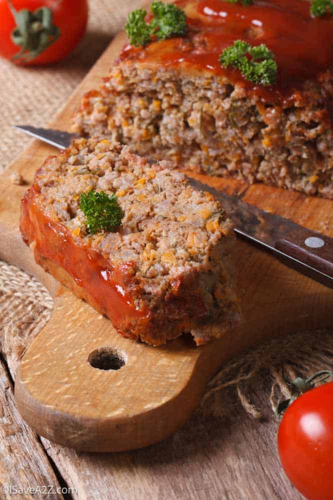 meat loaf with vegetables close-up on a cutting board. vertical