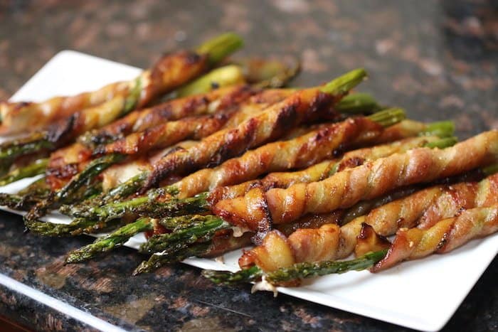 Keto Bacon Wrapped Asparagus made with a secret sauce!