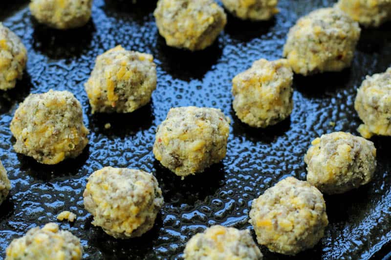 Keto Sausage Balls unbaked on a baking tray