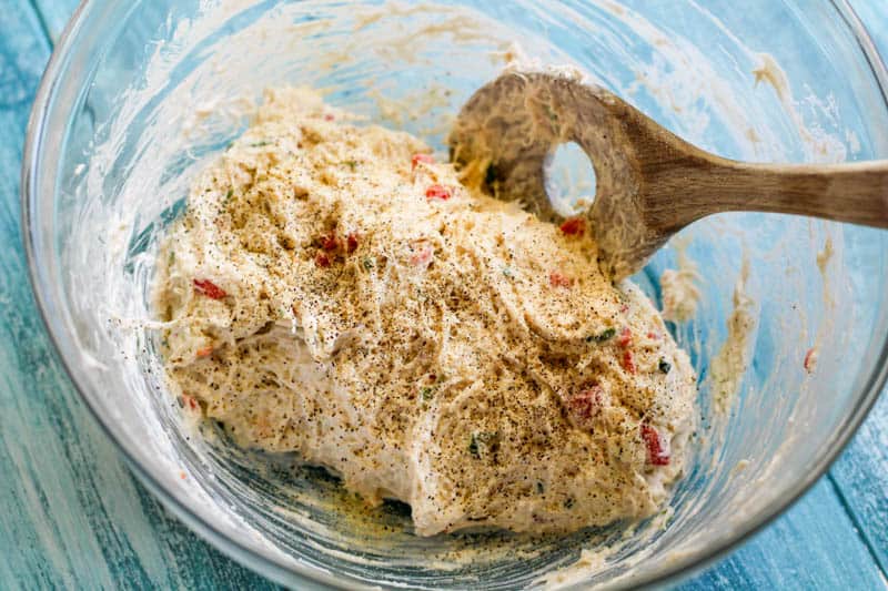 crab rangoon dip mixture in a glass bowl