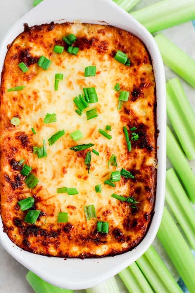 Keto Crab Rangoon Dip surrounded by celery