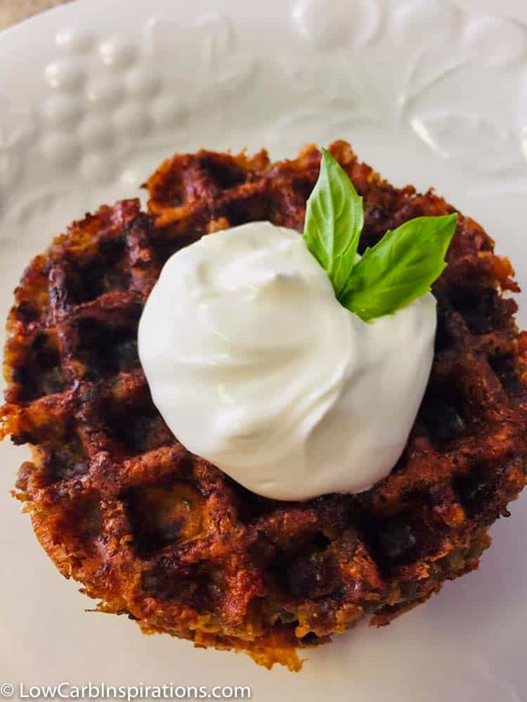 Keto Sausage Ball Chaffle Recipe Topped with sour cream!