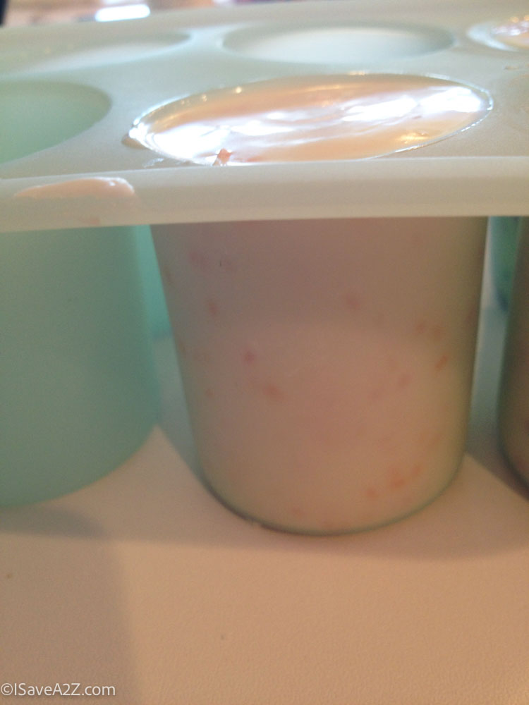 close up of a peach milk shake in a cup mold
