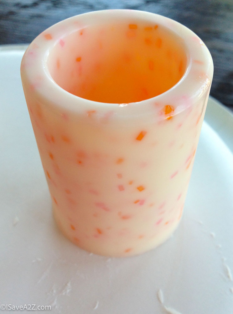 close up of peach milkshake with sprinkles