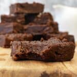 close up of Sugar-free Chocolate Fudge on a wood cutting board