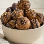 side photo of pecan pie truffle balls in a white bowl