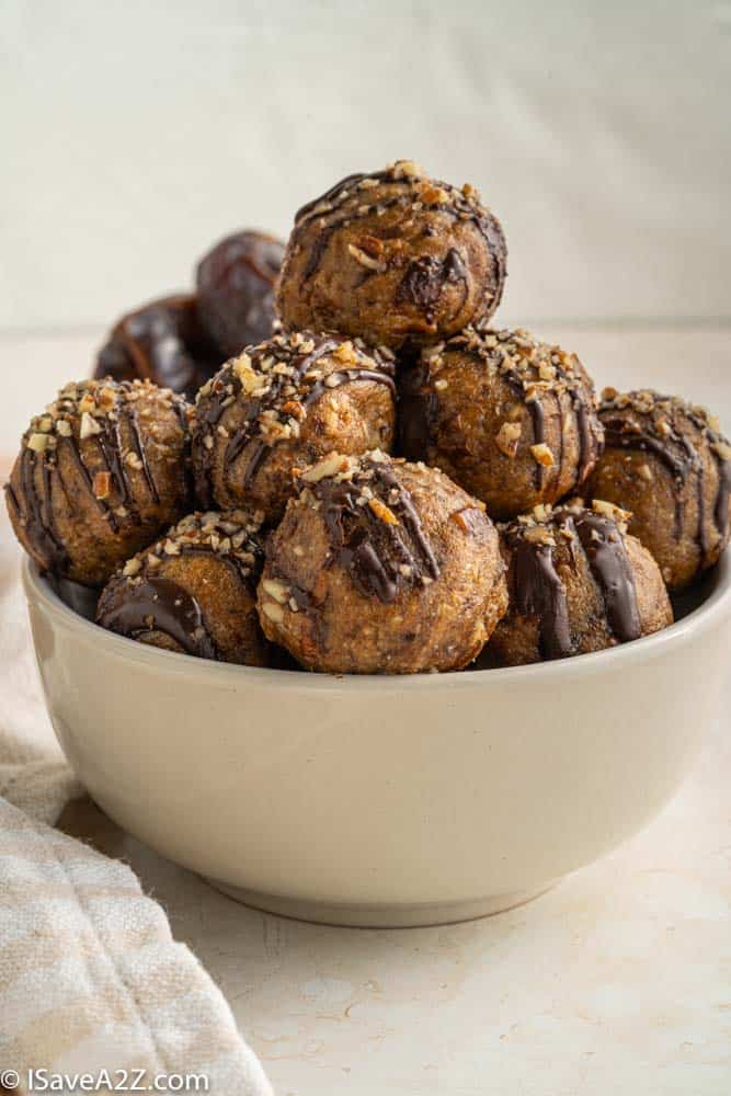 side photo of pecan pie truffle balls in a white bowl