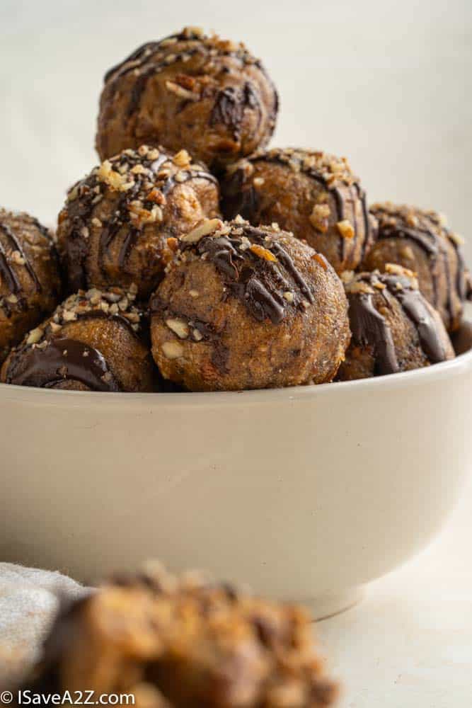 close up photo of pecan pie truffle balls in a white bowl