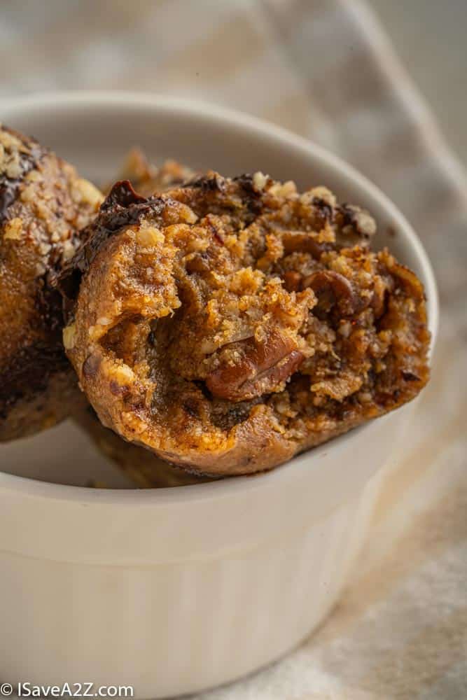 close up photo in a small bowl with pecan pie truffles for the holidays in a white bowl with a bite eaten
