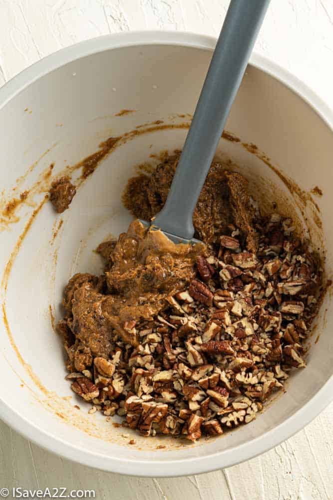 pecan pie truffle batter in a bowl with pecans